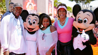 Whitney Houston, Bobby Brown and Bobbi Kristina Brown in 2004 (Lisa Rose/Disney Parks via Getty Images)